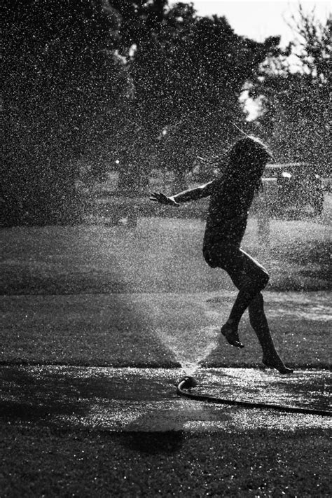 "Running through a Sprinkler ~ we couldn't get enough of this...all summer" by Lacie Widseth | Scrolller