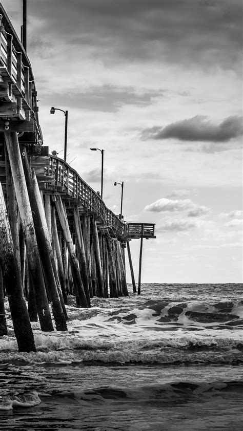Download wallpaper 1350x2400 sea, pilings, pier, waves, black and white ...
