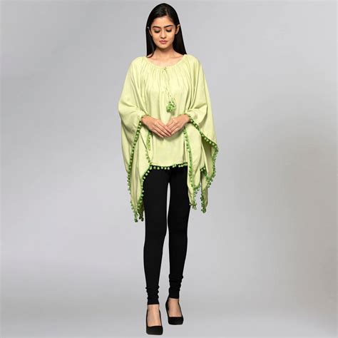 Green Pom Pom Poncho – First Resort by Ramola Bachchan