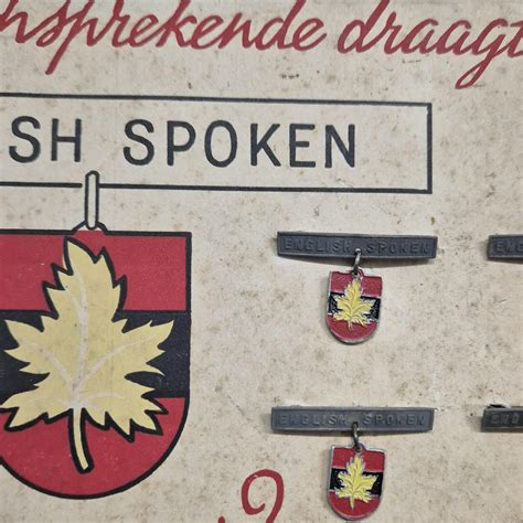 Set of twelve ‘English Spoken’ interpreter pins (Dutch civilian issue ...