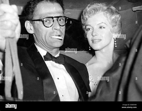 Starlet Marilyn Monroe in a car with husband Arthur Miller Stock Photo ...
