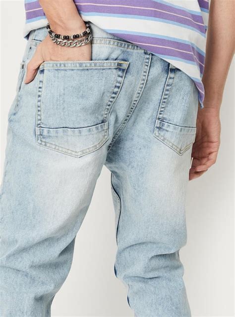 Buy Men Washed Carrot Fit Jeans Online at just Rs. 1399.0 ...