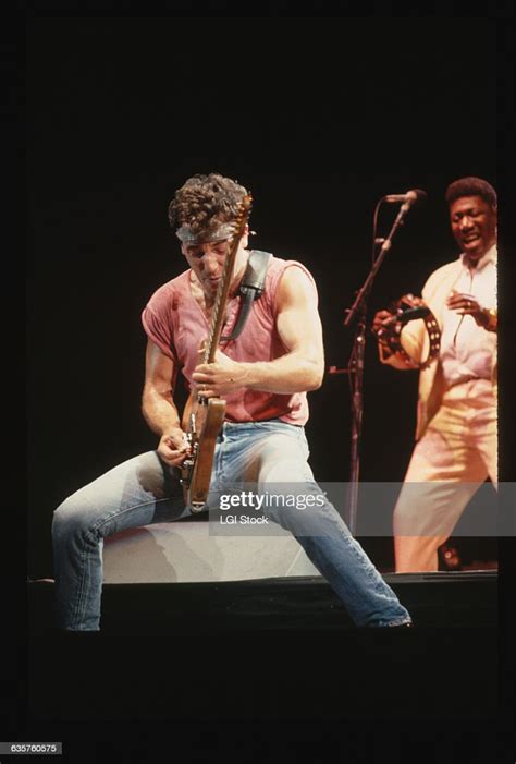 Bruce Springsteen during the 1985 "Born in the USA" tour. Behind him ...