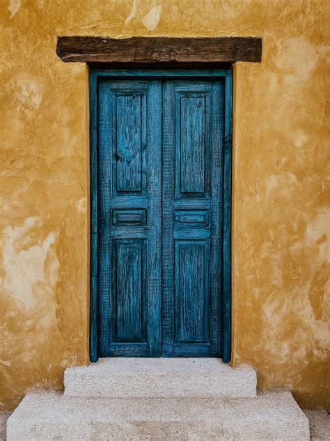 Download Antique Wooden Blue Double Door Wallpaper | Wallpapers.com