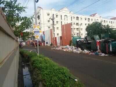 pilling up garbage - Times of India