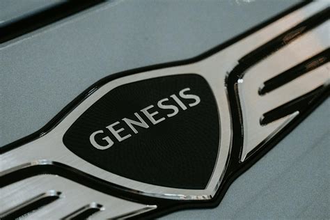 Close-up of Genesis Car Logo Emblem · Free Stock Photo
