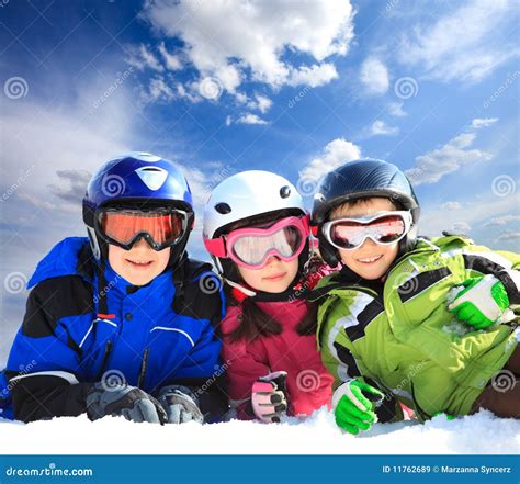 Children in ski clothing stock image. Image of helmets - 11762689