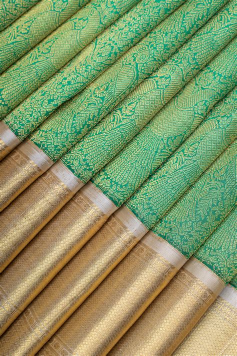 Green and ivory iruthalaipakshi brocade pure Kanchipuram silk saree ...