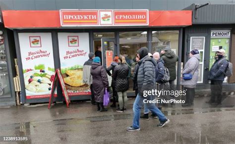 People stand in lines at an Upper East Side grocery store in New York.