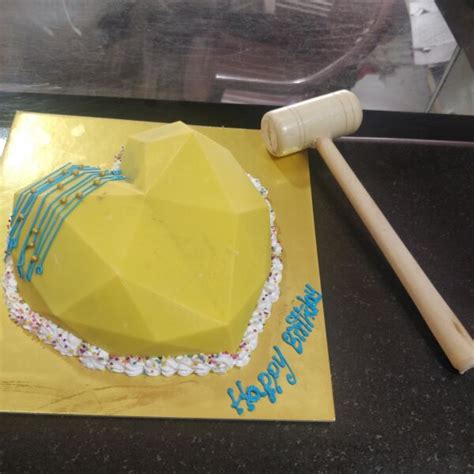 Order Pinata Cakes heart shape yellow design from The Baker
