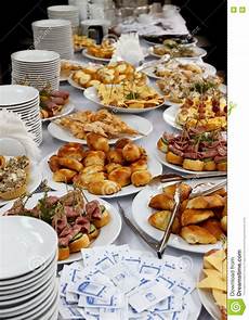 il banchetto catering catering banquet table with baked food snacks sandwiches il banchetto catering catering banquet table with baked food snacks sandwiches