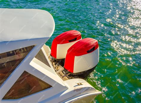 Premium Photo | Two outboard motors at the stern of the boat.