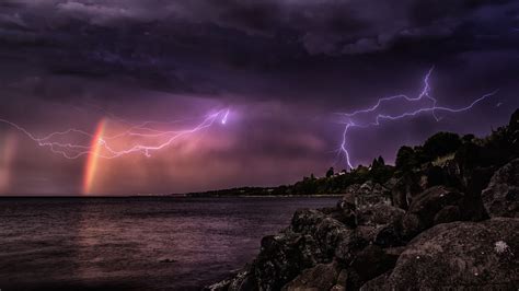 A rainbow in front of an impressive thunderstorm | Rainbow, Lightning ...