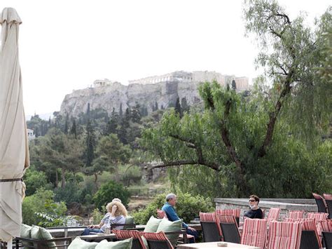Soaking up the sun! People feel 'alive again' as Greece reopens ...