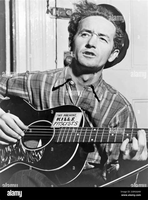 WOODY GUTHRIE (1912-1967) Promotional photo of American folk musician ...