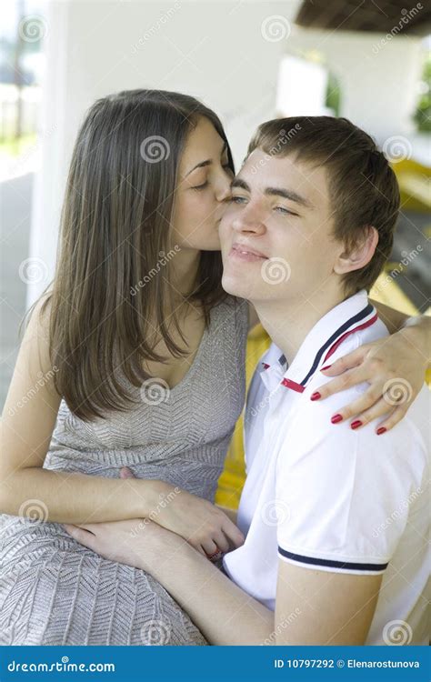 Young Happy Couple. Girl Kiss Her Boyfriend Stock Photo - Image of cute ...