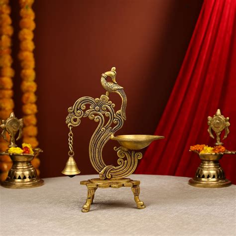 Carved Peacock Design Brass Diya With Bell – Ethnic India Handicrafts