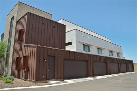 Standing Seam Metal Siding: [Installation, Cost + Panel Systems]