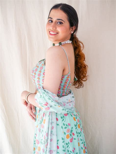 Hand embroidered ice blue blouse with a high waisted floral printed le ...