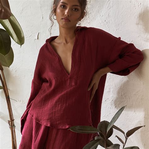Picture this trendy top with a single placket, a deep neckline, and ...