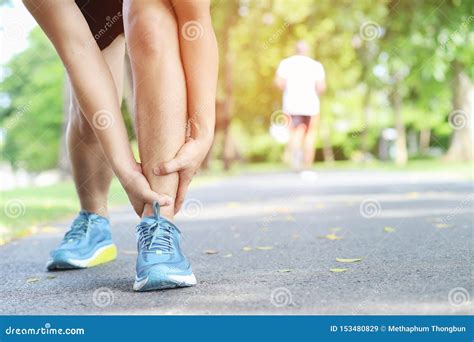 Runner Touching Painful Twisted or Broken Ankle. Athlete Runner ...