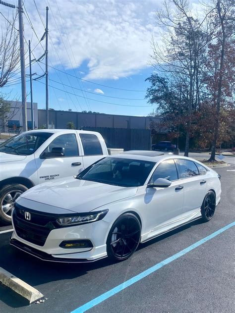 Two White Honda Accords Parked in a Sunny Parking Lot