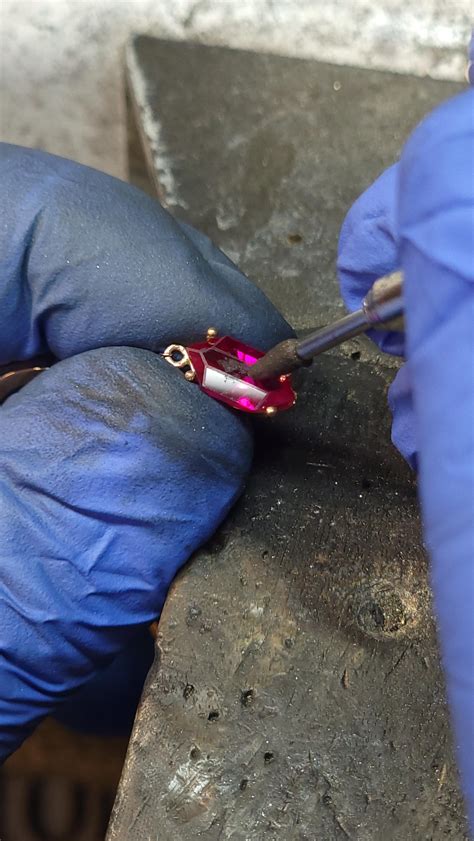 Made a zelda inspired earring with a created ruby rupee I cut! The ruby is 10x5.5mm and is about ...