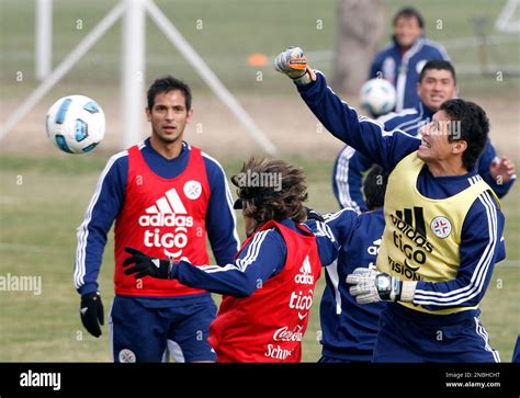Paraguay's goalkeeper Roberto Fernandez, right, blocks the ball during ...