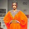 A model showcases a creation by designers Ashima and Leena on Day 2 of ...