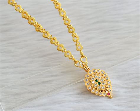 Gold tone 24 inches heart chain with south indian ad pink-green-white ...