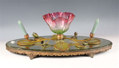 A 1930s glass and polychrome painted spelter table epergne, cast with ...
