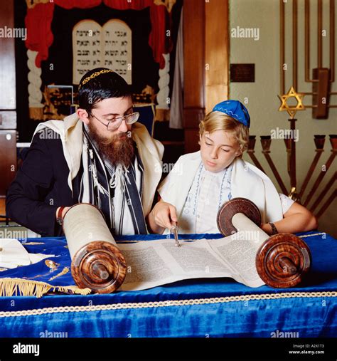 Jewish ceremony. Bar Mitzvah instruction. Rabbi with young boy Stock ...