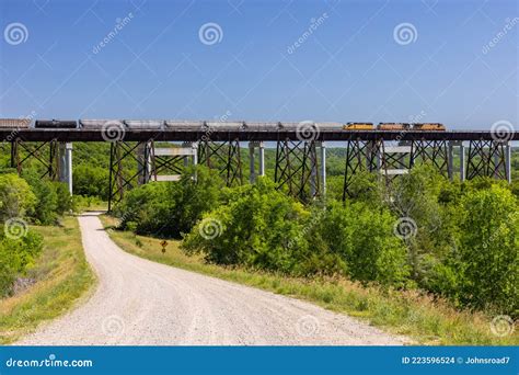 Freight Train Traveling Across High Trestle Bridge Stock Photo - Image ...
