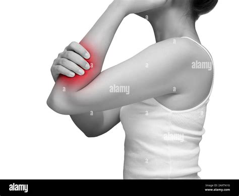 woman suffering from arm pain, painful in arm muscles. mono tone color with red highlight at arm ...