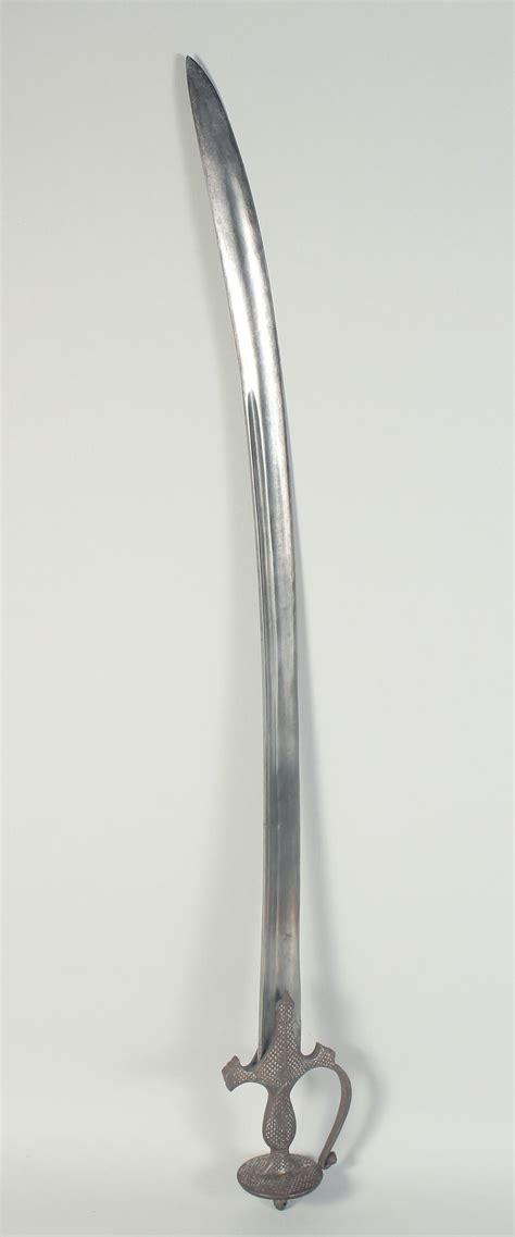 Bid Now: A FINE 18TH CENTURY INDIAN DECCANI TULWAR SWORD, with silver ...