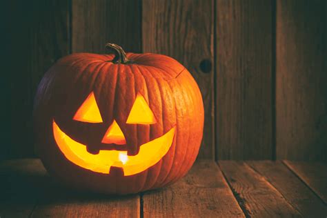 Download A lighted carved design of a classic Jack O Lantern ...