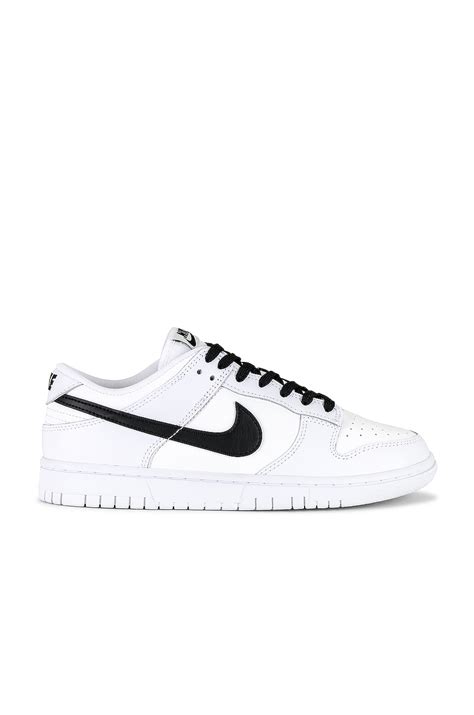 Nike Dunk Low Retro Sneaker in White, Black Summit, & White | REVOLVE