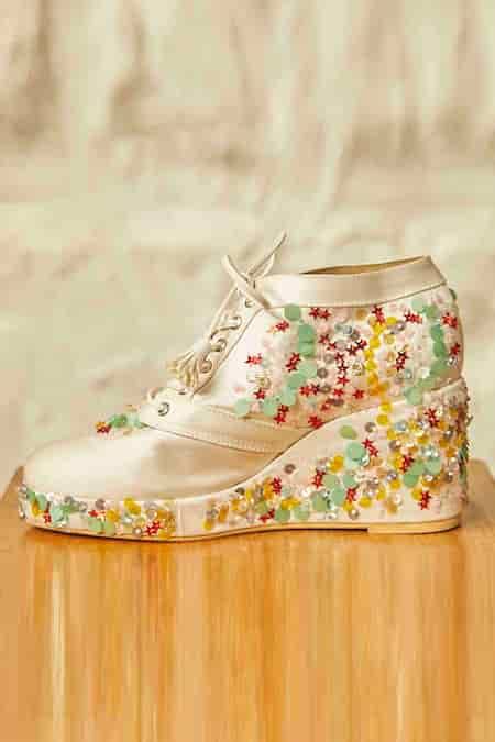 Buy White Embroidery Star Sneaker Wedges by Tiesta Online at Aza Fashions.