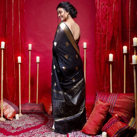 Banarasi kora organza saree in black color with triangle zari motifs a ...