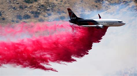 Wolf Fire continues to burn on the hillside in Banning on Monday