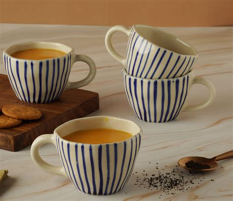 Buy White and Blue Handpainted Ceramic Tea Cup Set of 4 Online in India ...