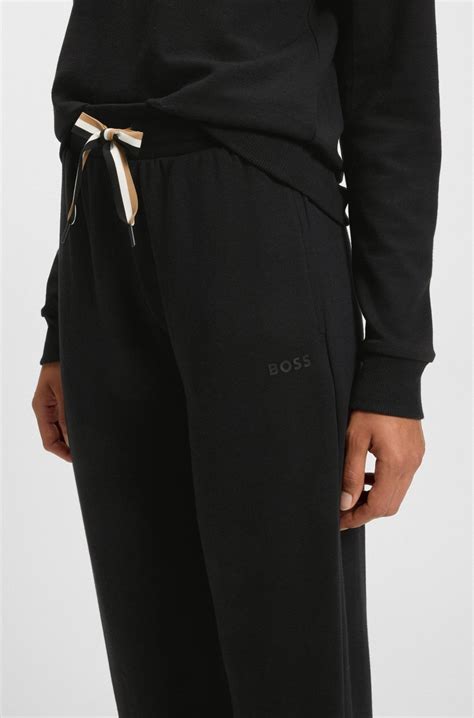 BOSS - Cuffed tracksuit bottoms with signature-stripe cords - Black