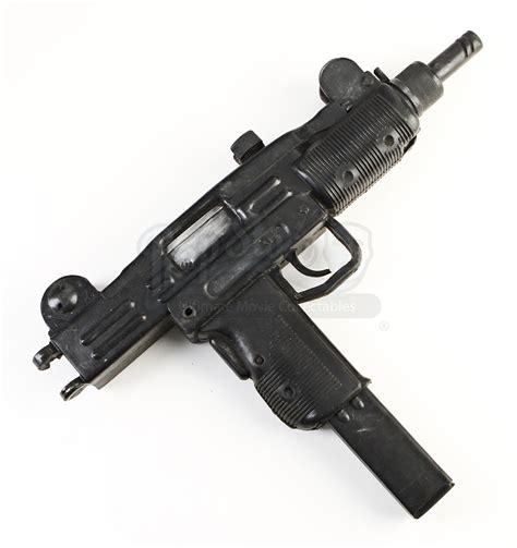 File:DarkKnightRisesMiniUzi.jpg - Internet Movie Firearms Database - Guns in Movies, TV and ...