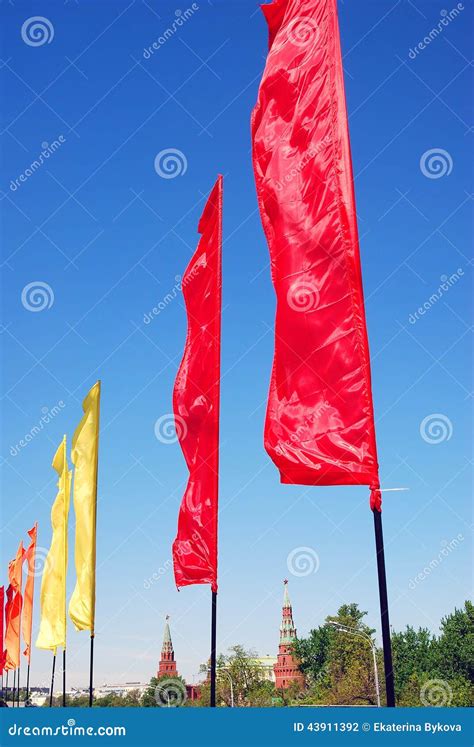 Red And Yellow Flags. Blue Sky Background. Stock Photography ...