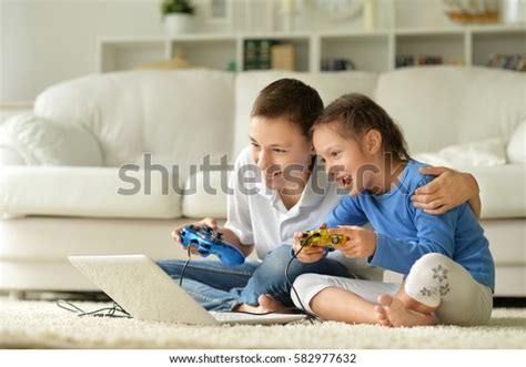 Kids Playing Computer Games Stock Photo (Edit Now) 582977632