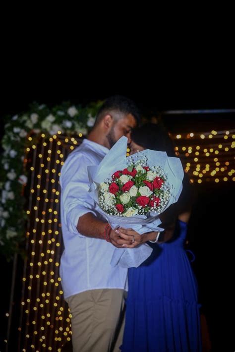 The Beach Marriage Proposal with marry me neon sign board