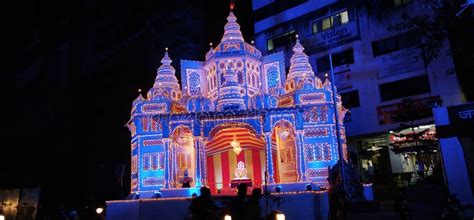 Temple at night illuminated with light from decorations