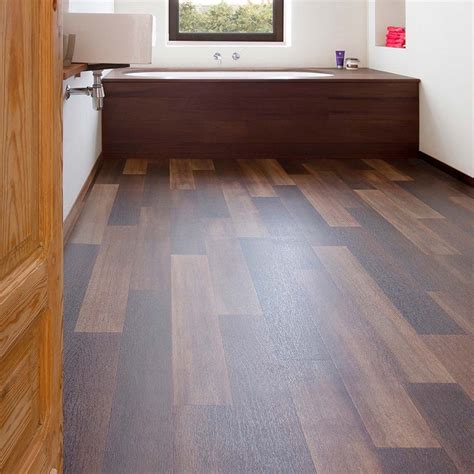 This wood effect vinyl flooring is full of natural tone and detail that ...