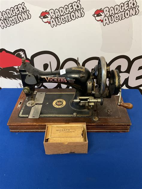 Vintage vickers hand cranked sewing machine with attachments – Badgers Auctions