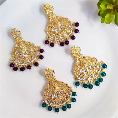 Elegant Gold-Tone Filigree Chandelier Earrings with Jewel Accents ...
